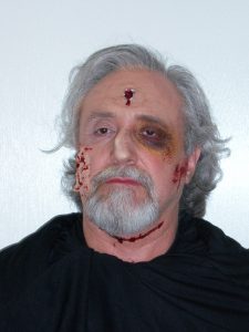James Capers as the Priest